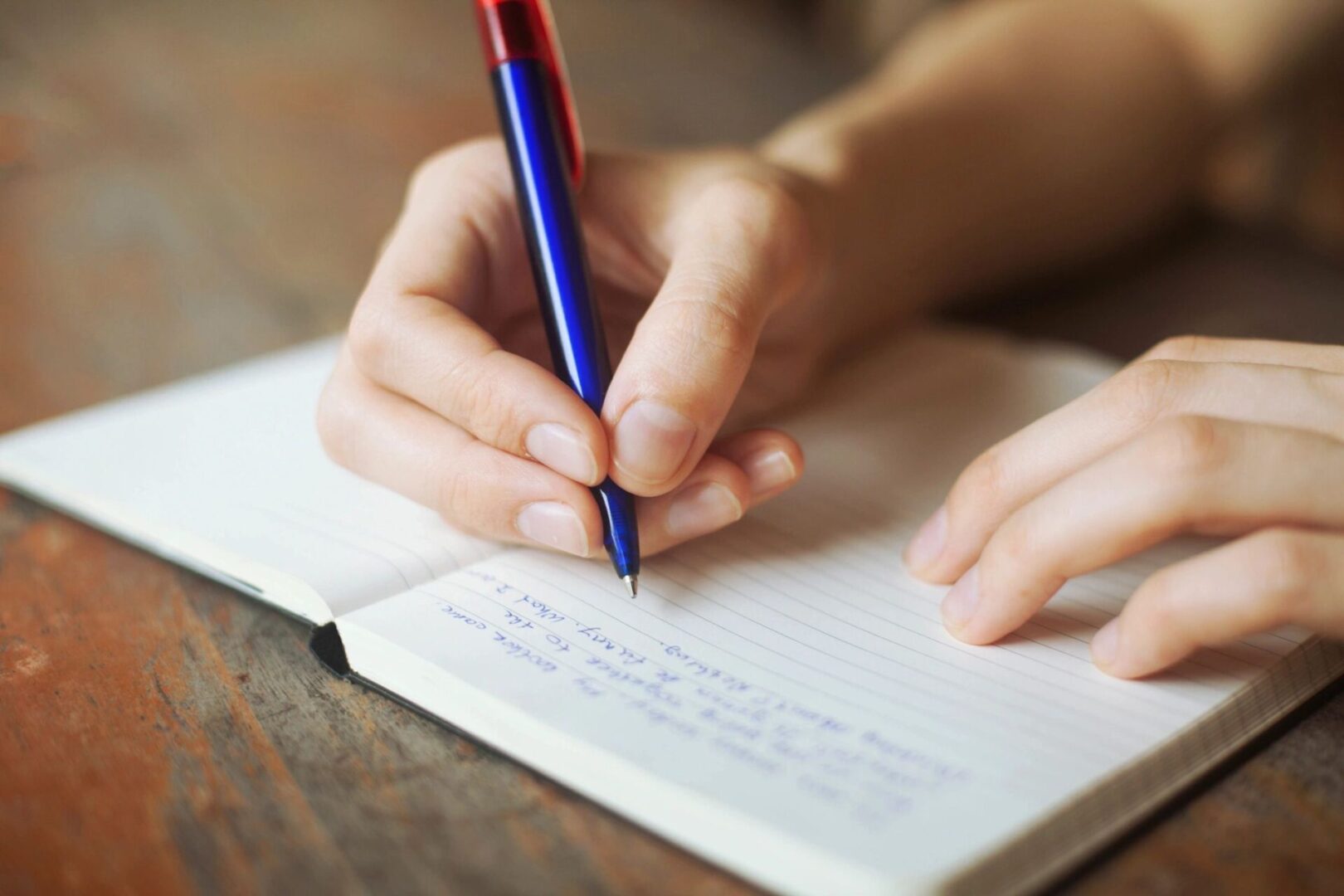 A hand holding a pen